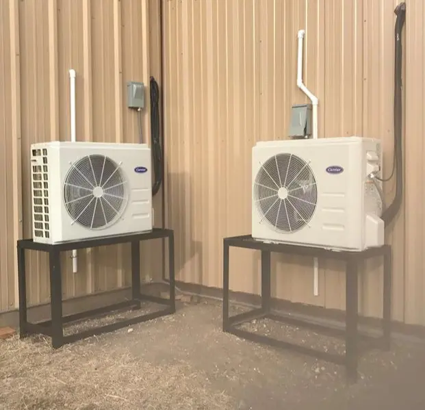 Technician installing a ductless mini split system